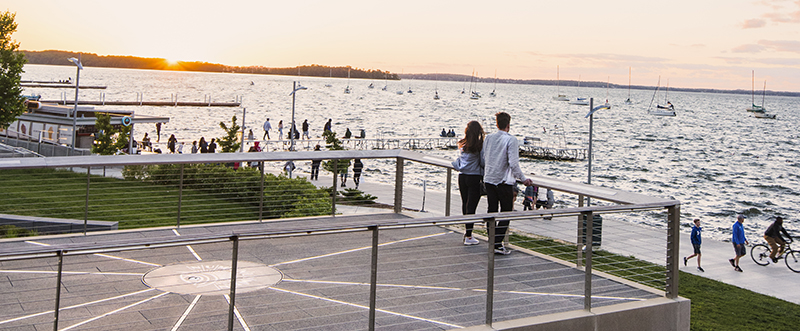 People enjoying the view of Lake Mendota from Alumni Park