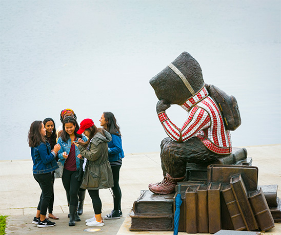 Visitors gather around Well Red Bucky